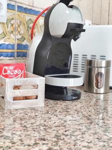 a coffee maker sitting on top of a kitchen counter at El Jándalo in Benaocaz