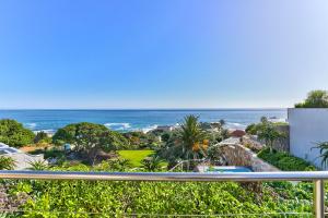 a view of the ocean from the balcony of a house at Ocean View House in Cape Town