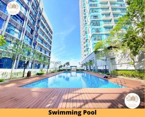 a swimming pool in the middle of a building at Pacific Home Petaling Jaya by Seven Sins in Petaling Jaya