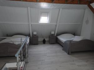 Un pat sau paturi într-o cameră la Huis "Del Mar"