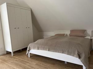 Ένα ή περισσότερα κρεβάτια σε δωμάτιο στο Ferienhaus Austernfischer