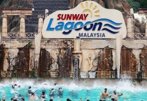 a group of people in the water at a water park at Exclusive Family Suites @ Sunway Pyramid Resort in Petaling Jaya