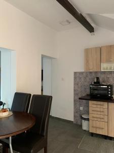 Kuchyň nebo kuchyňský kout v ubytování Apartment Citta Vecchia
