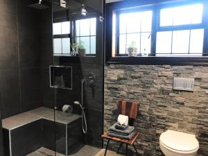 a bathroom with a shower and a toilet at Kaya La Provence in Cape Town +64 photos
