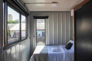 Una cama o camas en una habitación de Charmoso Studio Moema