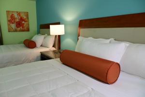 Voodi või voodid majutusasutuse Quints Travelers Inn toas