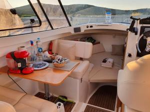 a small table in the back of a boat at Nuit Insolite sur un Bateau in Saint-Florent