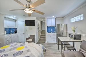 a kitchen with a bed and a ceiling fan at Cute Central Placerville Studio Pet Friendly in Placerville