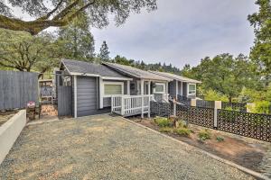 a house with a fence in front of it at Pet-Friendly House with Deck Less Than 3 Mi to Dtwn! in Placerville