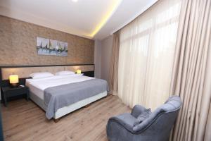 Postel nebo postele na pokoji v ubytování PENTAHOR HOTEL