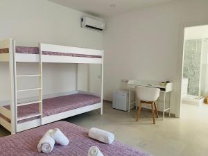 Postel nebo postele na pokoji v ubytování B&B S'arciaredda
