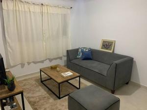 a living room with a couch and a coffee table at Alba II - Departamento 2 ambientes in Posadas +1 photo