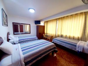 Katil atau katil-katil dalam bilik di Hotel Wayra