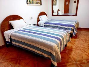 Katil atau katil-katil dalam bilik di Hotel Wayra