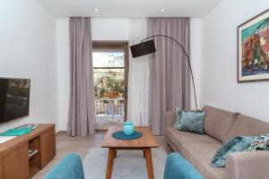 TV a/nebo společenská místnost v ubytování Hotel Eleven