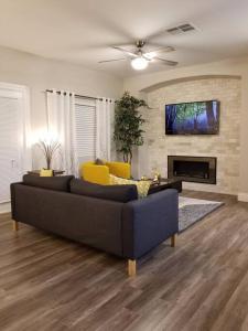 a living room with a couch and a fireplace at A - Fully remodeled and professionally decorated in Las Vegas