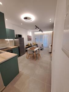 Kuchyň nebo kuchyňský kout v ubytování Pleasant Stay