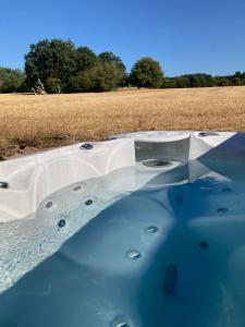 a pool of water in front of a field at Rhönstrand in Wartmannsroth