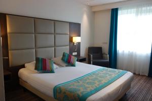 Postel nebo postele na pokoji v ubytování Hotel Middelburg