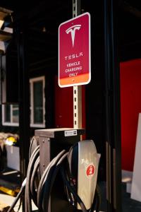 a sign for a t tech vehicle charging only at Hotel Corvallis in Corvallis