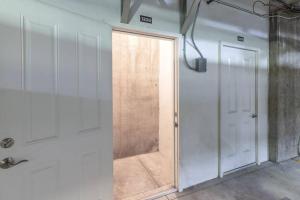 a door leading to a shower in a room at Beautifully Updated PC condo w Pool, Hot Tub, Gym! in Park City +25 photos