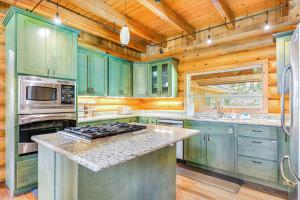 a kitchen with green cabinets and a stove top oven at Alderbrook Grove in Union
