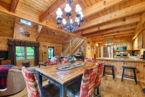 a dining room and kitchen with a table and chairs at Forest Hideaway in Maggie Valley