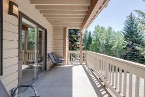 a porch of a house with a chair on it at Teewinot C2 in Teton Village