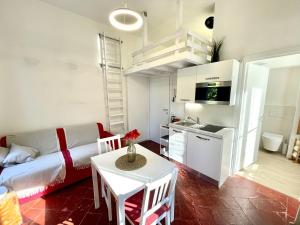 a living room with a couch and a table at AvocadoHouse2VistaTerme in San Pellegrino Terme +12 photos