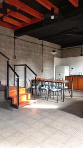 a room with a table and some chairs and a table and a table and chairs at terraza con asador privado in Termas de Río Hondo +28 photos