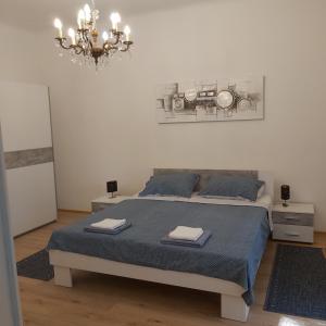 Posteľ alebo postele v izbe v ubytovaní Apartman Fiume