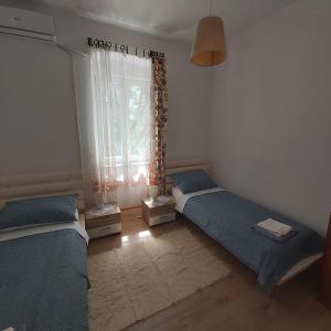 Posteľ alebo postele v izbe v ubytovaní Apartman Fiume