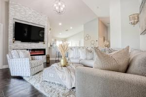 a living room with a couch and a fireplace at Remington View Retreat in Kissimmee