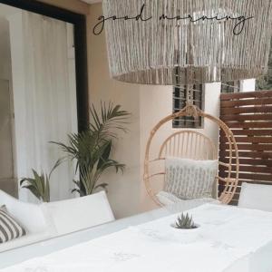 a dining room with a table and chairs and a chandelier at Family House Los Cuatro Robles in San Pedro +55 photos