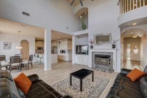 a living room with a couch and a fireplace at Hill Country Haven in Lago Vista