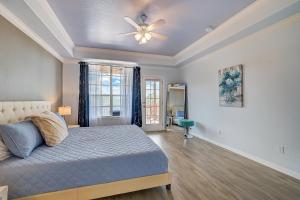 a bedroom with a bed and a ceiling fan at Hill Country Haven in Lago Vista