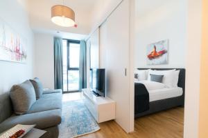Postel nebo postele na pokoji v ubytování Vienna Residence, Marina Tower - Danube