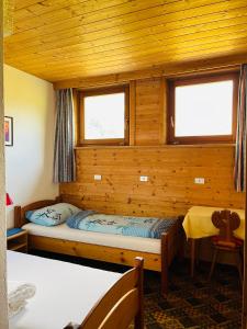 Llit o llits en una habitació de Ferienhaus Bruggerhof