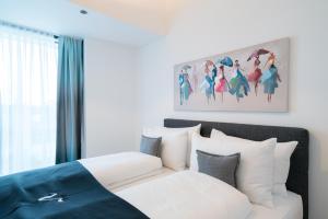Postel nebo postele na pokoji v ubytování Vienna Residence, Marina Tower - Danube
