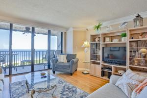 a living room with a view of the ocean at Lighthouse Towers 1002 in Clearwater Beach