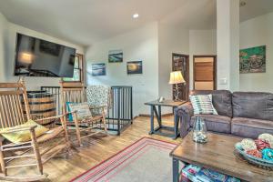 a living room with a couch and a table at Home on Douglas Lake - Fish and Kayak! in Dandridge
