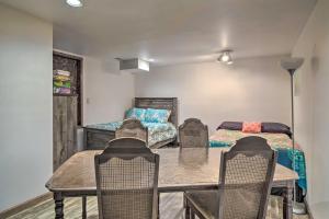 a dining room with a table and chairs and a bed at Home on Douglas Lake - Fish and Kayak! in Dandridge