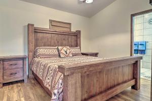 a bedroom with a large wooden bed and a window at Home on Douglas Lake - Fish and Kayak! in Dandridge