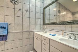 a bathroom with a sink and a mirror at Home on Douglas Lake - Fish and Kayak! in Dandridge
