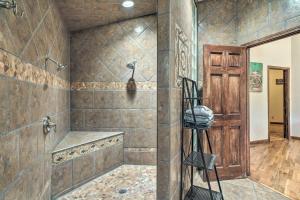 a bathroom with a tub and a shower stall at Home on Douglas Lake - Fish and Kayak! in Dandridge