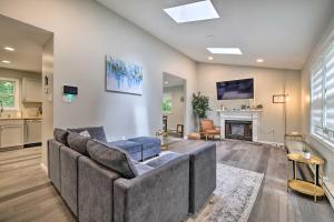 a living room with a couch and a fireplace at Furnished Deck and Lake Access Poconos Place! in Tobyhanna