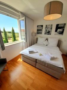 Ліжко або ліжка в номері Lovely Rooms Rovinj