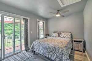 a bedroom with a bed and a large window at Cozy North Bend Getaway Near Dunes and Ocean! in Lakeside