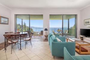 a living room with a view of the ocean at Kalami Beach - Villa Almyra in Kalami