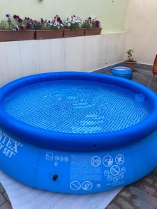 a large blue hot tub sitting on a patio at Gyumri house in Gyumri